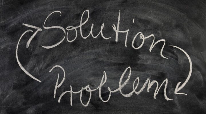 Solution problem written on a black board in white chalk